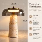 A travertine stone table lamp with a glass dome shade, shown with dimension annotations (23 cm diameter and 34 cm height) and feature callouts on a beige background.