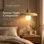 Yellow stone pendant light above a bedside table in a calm Scandinavian bedroom
