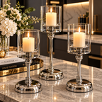 Glass pillar candle holders in gold and silver finishes styled together for elegant home decoration