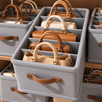 Handbag storage organizer box with dividers separating handbags for tidy wardrobe storage