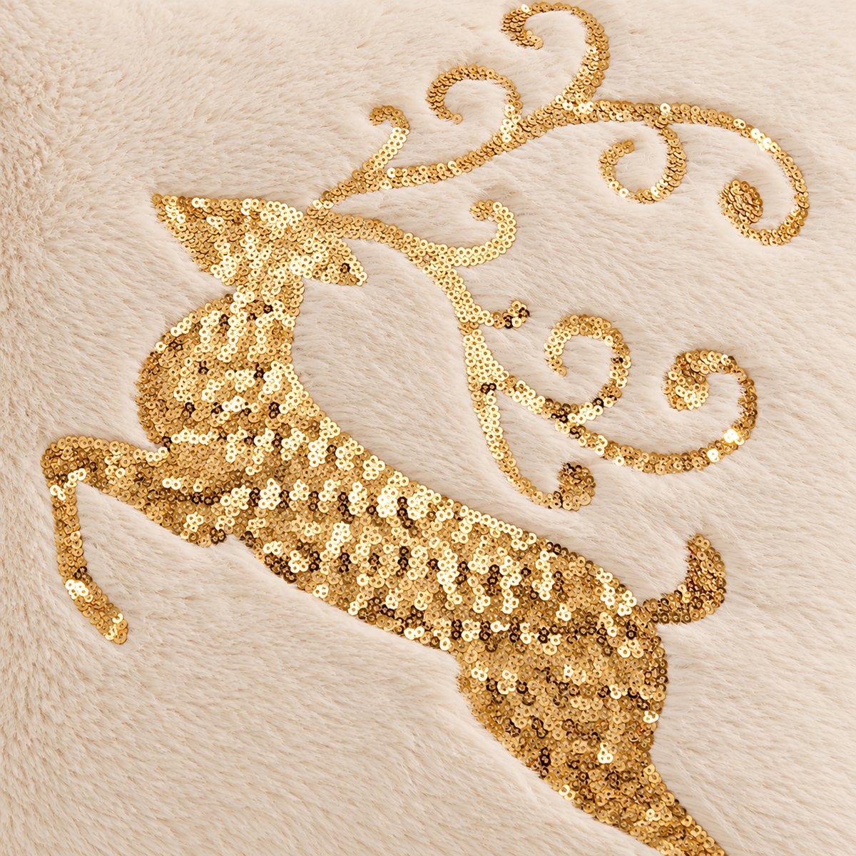 Christmas faux fur pillow cover with a gold embroidered reindeer design