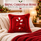 Close-up of a red Christmas candy cane pillow cover showing its decorative design and fabric details