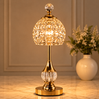 Cordless crystal table lamps adding a luxurious glow beside a cream sofa and marble table