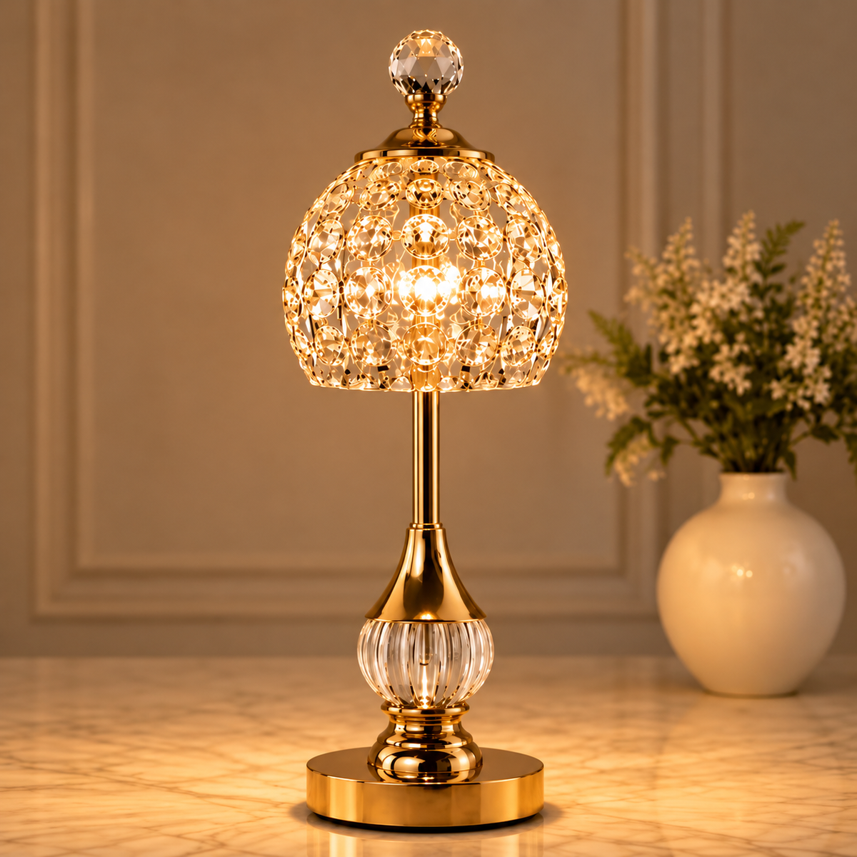 Cordless crystal table lamps adding a luxurious glow beside a cream sofa and marble table
