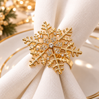 Christmas napkin rings featuring an elegant gold snowflake design with sparkling decorative stones.