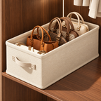 Handbag storage organizer box in beige with handbags neatly arranged on a wooden wardrobe shelf