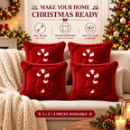 Red Christmas candy cane pillow cover with decorative white candy cane design and bows
