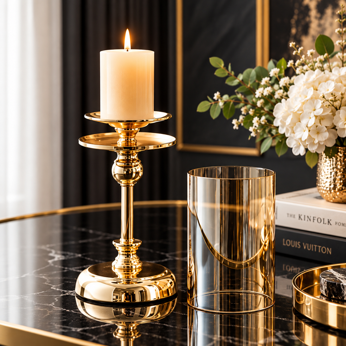 Gold glass pillar candle holders with a clear glass hurricane shade and polished metal base