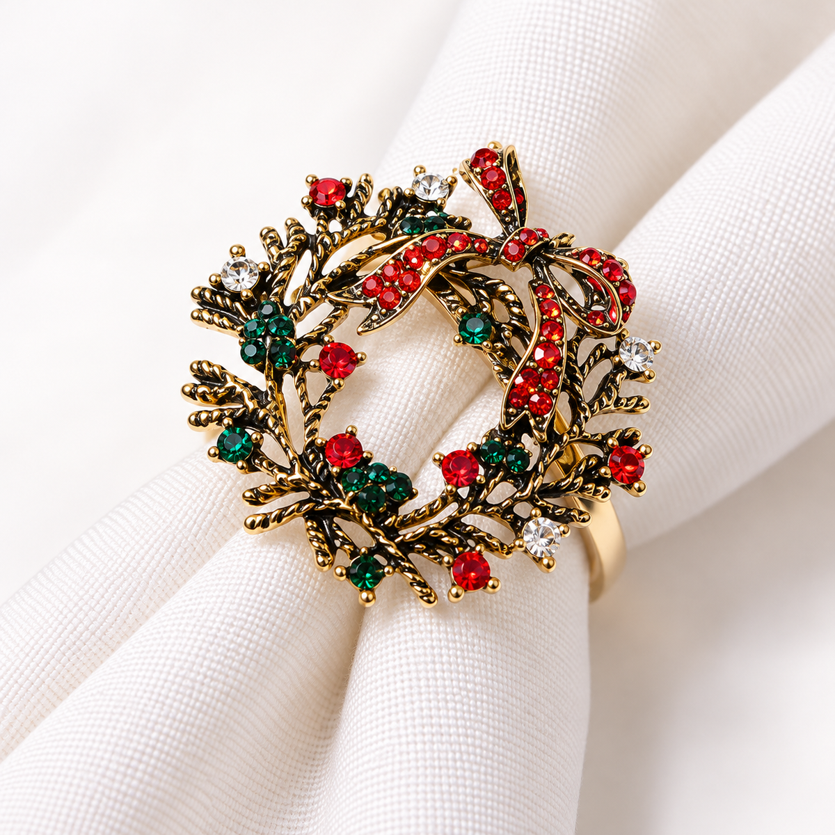Christmas napkin rings with a decorative Christmas wreath design and red and green accents.