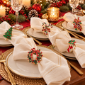 Christmas napkin rings decorating folded napkins on an elegant festive holiday dining table