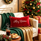 Red Merry Christmas pillow covers with decorative embroidery on a sofa with a green knitted blanket and gold throw.