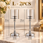 Gold glass pillar candle holders set of two featuring tall clear glass shades and polished bases