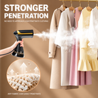 handheld garment steamer with black and gold design and two brush attachments