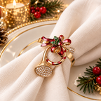 Christmas napkin rings with sparkling gold-tone details styled on a soft ivory napkin for holiday dining.