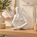 White abstract thinker sculpture styled with a neutral vase and Scandinavian home decor