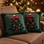 Embroidered Christmas pillow covers in forest green with festive Christmas tree embroidery arranged on a cozy chair.