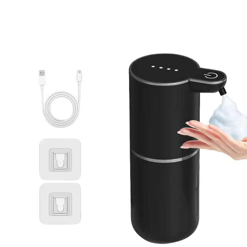 Black soap dispenser with USB cable and wall outlet adapter on a white background