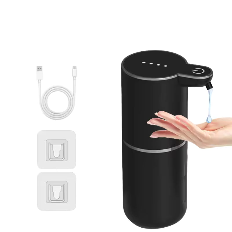 Black soap dispenser with USB cable and wall outlet adapter on a white background